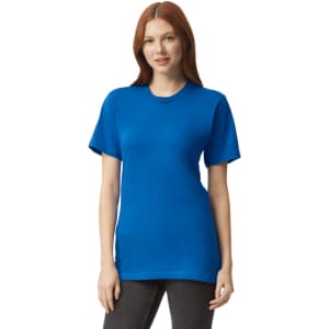 A blue unisex short sleeve T-shirt displayed on a model, featuring a logo on the front.