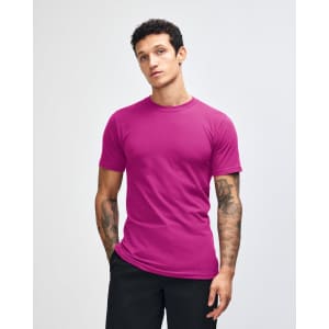 A unisex fine jersey short sleeve t-shirt in a vibrant purple colour, displayed on a model. It features a branding logo.
