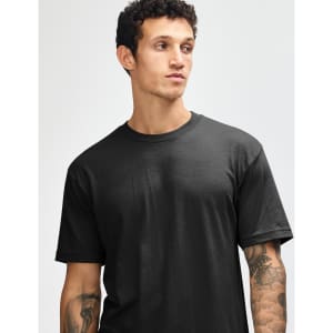 A black unisex short sleeve T-shirt worn by a model, showcasing a simple, classic design.