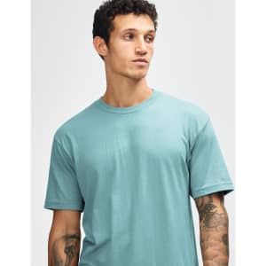 A unisex short sleeve t-shirt in a soft turquoise colour, featuring a logo on one side.