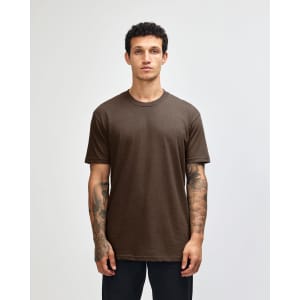 A unisex short sleeve t-shirt in brown, featuring a relaxed fit and a simple design. It has a branding logo.