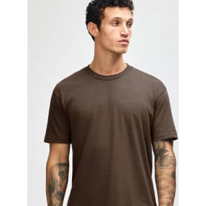 Unisex short sleeve t-shirt in brown, featuring a simple design and a logo on the fabric.