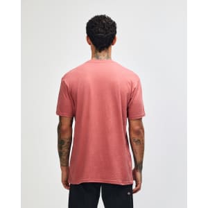 A unisex CVC short sleeve t-shirt in a dusty pink colour, featuring a logo on the back.