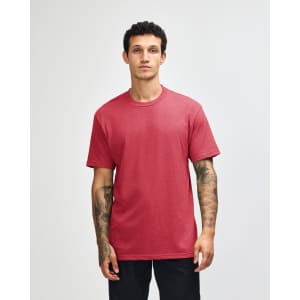 A unisex CVC short sleeve t-shirt in a burgundy colour, featuring a model wearing it and a plain design.