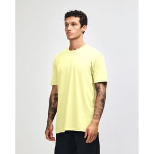 A unisex CVC short sleeve t-shirt in bright yellow, displayed on a model against a neutral background.