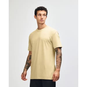 A unisex short sleeve t-shirt in a soft yellow colour, featuring a relaxed fit and a logo.