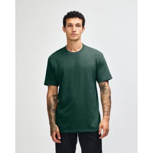 A model displays a unisex short sleeve t-shirt in dark green, featuring a logo on the front.