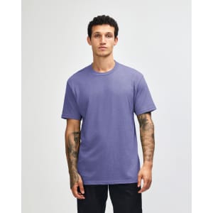 A unisex short sleeve T-shirt in a vibrant purple colour, featuring a simple design and a logo.