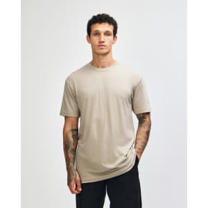 A unisex short sleeve T-shirt in olive green, featuring a simple design and a logo.