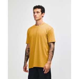 A unisex short sleeve t-shirt in a rich mustard yellow colour, featuring a logo on the front.
