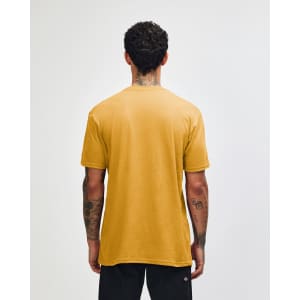 A unisex CVC short sleeve t-shirt in mustard yellow, featuring a plain back and casual fit. It has a small logo.