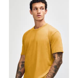 A unisex short sleeve t-shirt in a mustard yellow colour, featuring a simple design and a logo.