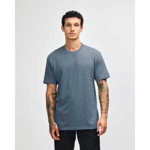 A unisex CVC short sleeve t-shirt in a blue colour, featuring a logo on the front.