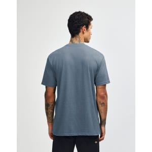A unisex short sleeve T-shirt in a blue hue, featuring a simple design and a brand logo.