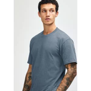 A unisex short sleeve t-shirt in a muted blue colour, featuring a simple design and a logo.