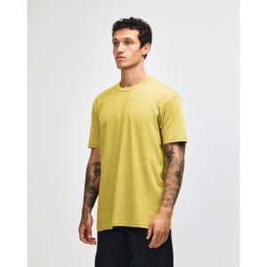 A unisex short sleeve t-shirt in a vibrant yellow colour with a casual fit, displayed on a model.