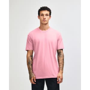 A unisex short sleeve T-shirt in pink, featuring a crew neck and a plain design, with a logo present.