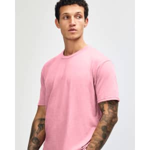 A unisex short sleeve T-shirt in pink, featuring a simple design and a logo.