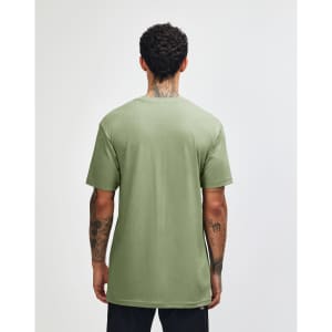 A green unisex CVC short sleeve T-shirt viewed from the back, featuring a plain design and a logo.