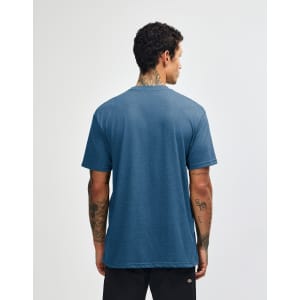 A unisex short sleeve t-shirt in a blue tone with a plain back and a logo on the label.
