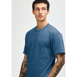 A unisex short sleeve t-shirt in a deep blue colour, featuring a simple design and a subtle logo.
