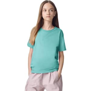 A teal youth t-shirt with short sleeves, featuring a logo on the front, displayed on a model.
