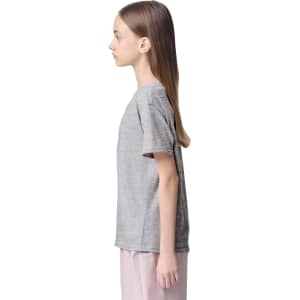 A grey youth T-shirt with short sleeves displayed on a model from the side. It includes a logo.