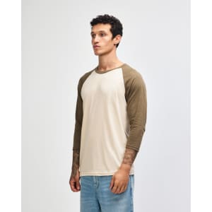 A unisex raglan T-shirt featuring a beige body with brown 3/4 sleeves and a logo.