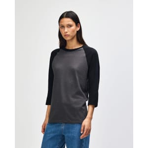 A unisex CVC raglan T-shirt featuring a grey body and black sleeves, with a logo on one side.