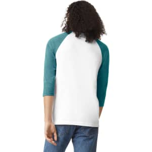 A unisex raglan T-shirt featuring a white body with teal three-quarter sleeves and a logo on the back.