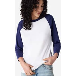 A white and navy unisex raglan T-shirt with three-quarter sleeves, featuring a logo.