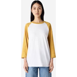 A unisex raglan T-shirt featuring a white body and mustard yellow sleeves. The shirt has a logo on it.