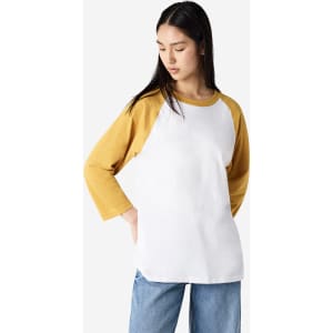 A unisex raglan t-shirt featuring yellow sleeves and a white body, with a logo on the front.