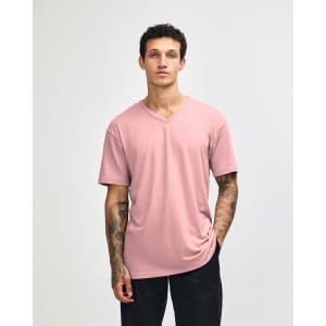 A unisex V-neck T-shirt in a soft pink colour, featuring short sleeves and a relaxed fit. It has a logo.
