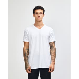 A white unisex V-neck T-shirt with short sleeves and a branded logo, displayed on a model.