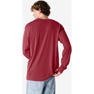 A long sleeve T-shirt in burgundy, featuring a plain back and casual fit. It has a logo.