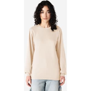 A long sleeve t-shirt in beige, featuring a loose fit and a logo on the front.