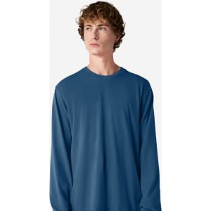 A long sleeve t-shirt in deep blue, featuring a simple design and a logo on the front.