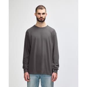 A grey long sleeve T-shirt featuring a round neck and a brand logo on the label.