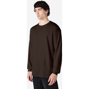 A long sleeve T-shirt in dark brown worn by a model, featuring a simple design and logo.
