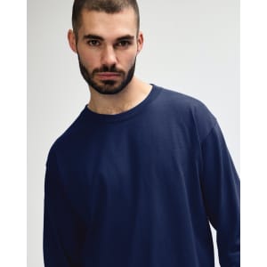 A navy long sleeve T-shirt designed for adults, displayed on a model with a neutral background.