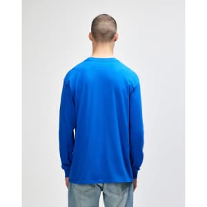 A blue long sleeve t-shirt with a round neckline, viewed from the back, worn by a person.