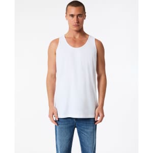 A white unisex fine jersey tank top displayed on a model, paired with blue jeans. The tank features a logo.