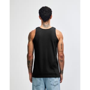 A black unisex fine jersey tank top is worn by a model, featuring a simple design and a logo.