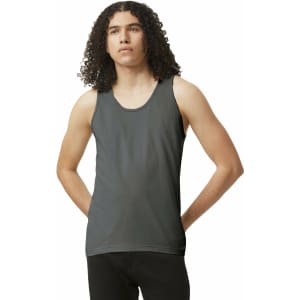A unisex fine jersey tank in dark grey, featuring a round neckline and a fitted style. The model has curly hair.