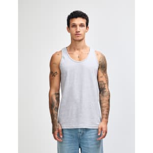 A light grey unisex fine jersey tank top is displayed on a model, featuring a simple design and a relaxed fit.