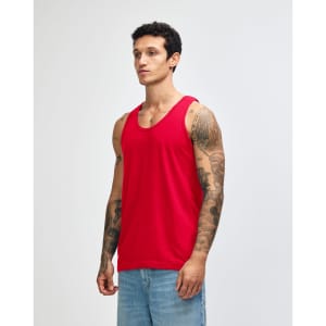 A red unisex fine jersey tank top is displayed on a model against a plain background. It has a logo on it.