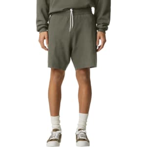 Unisex pique gym shorts in olive green with an elastic waistband and drawstring. Features a logo on the shorts.