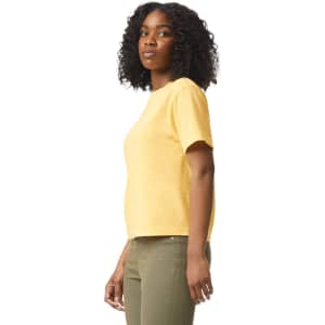 A yellow heavyweight boxy T-shirt displayed on a model, featuring a crew neckline and short sleeves.