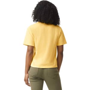 A yellow heavyweight boxy t-shirt viewed from the back, featuring short sleeves and a logo on the garment.